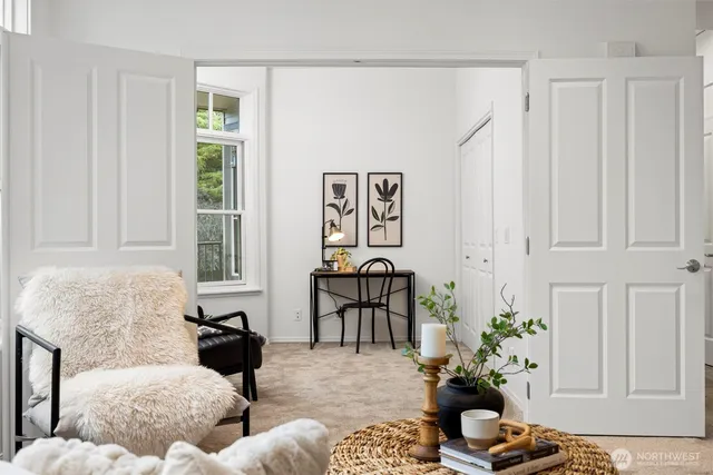 a living room with furniture and a window