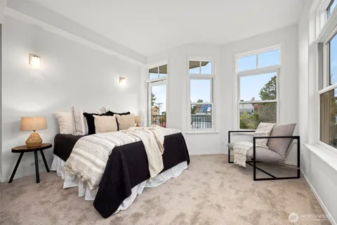 a bed room with a bed and a lamp