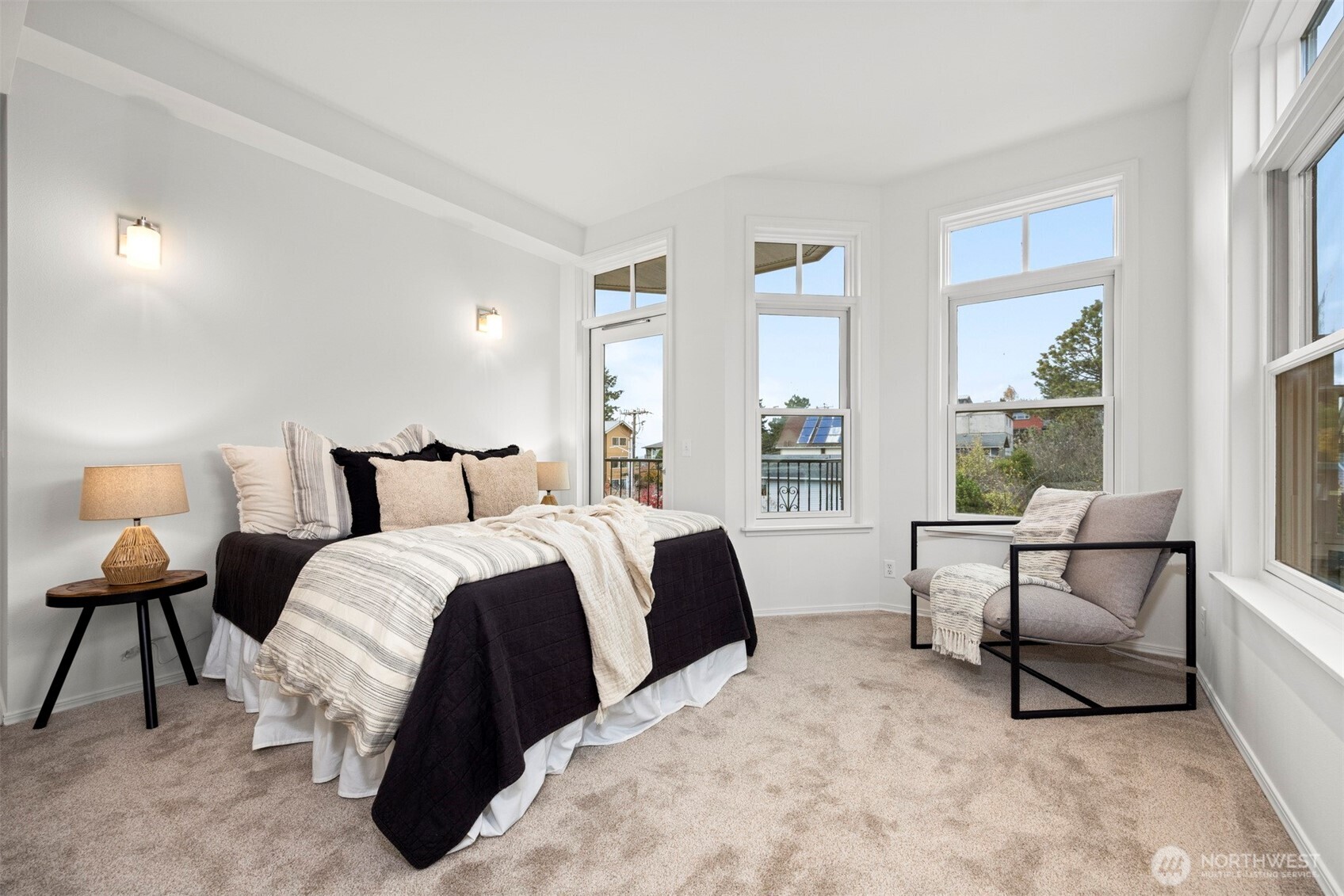 1201 13th Street, Unit 301 Bellingham, WA 98225 - Photo 22 of 38 a spacious bedroom with a bed and a large window