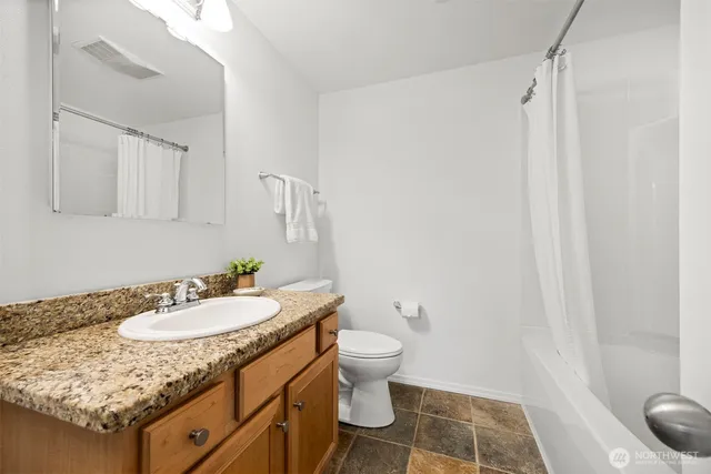 a view of washer and dryer in a utility room