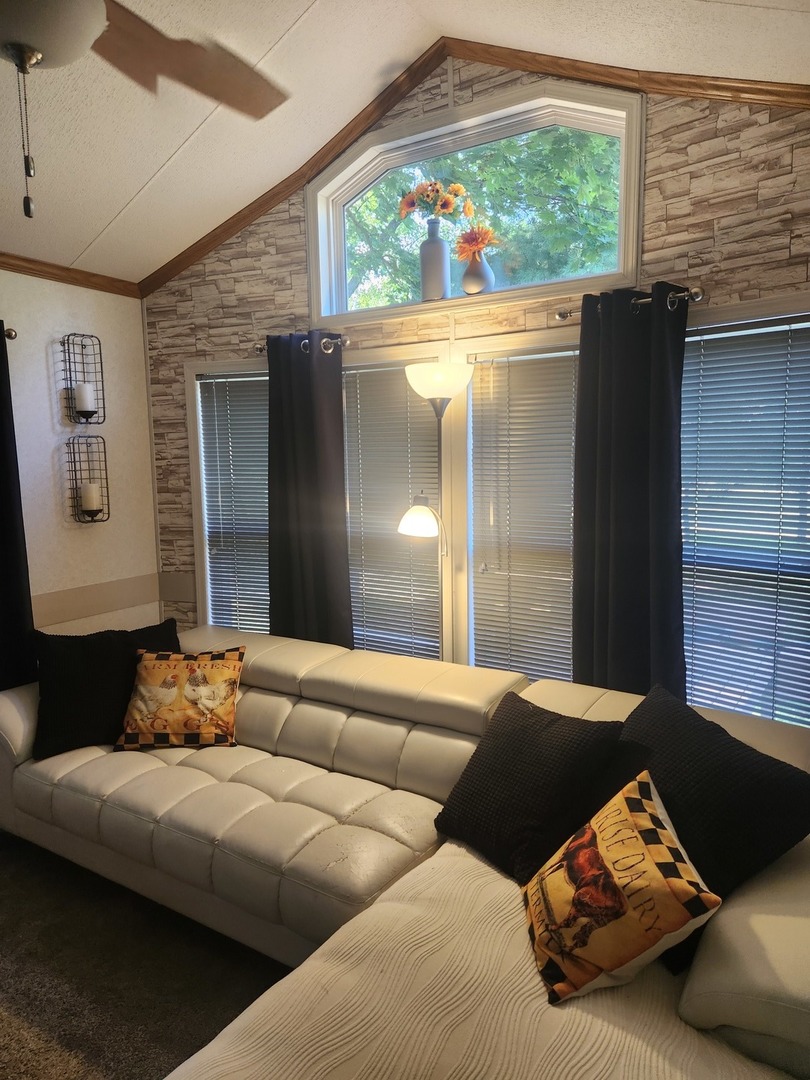 24-65 Woodhaven Lakes Sublette, IL 61367 - Photo 11 of 32 a living room with furniture and a large window