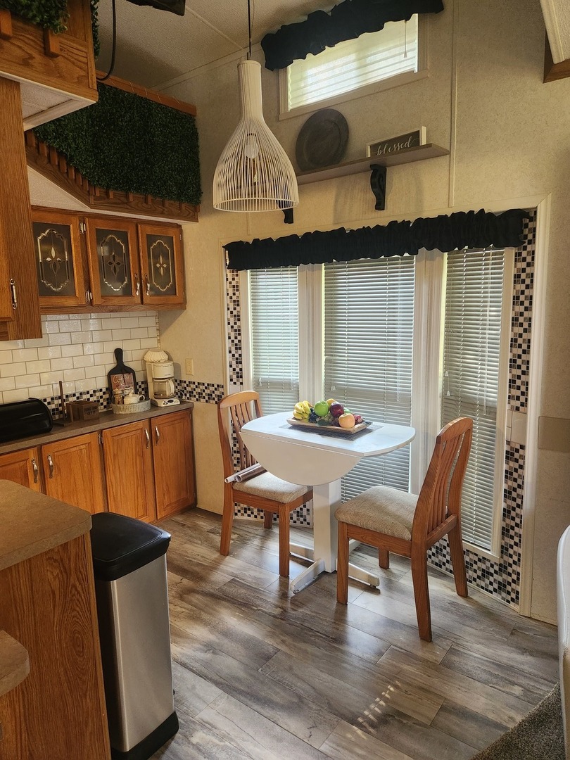 24-65 Woodhaven Lakes Sublette, IL 61367 - Photo 13 of 32 a view of a dining room with furniture and wooden floor