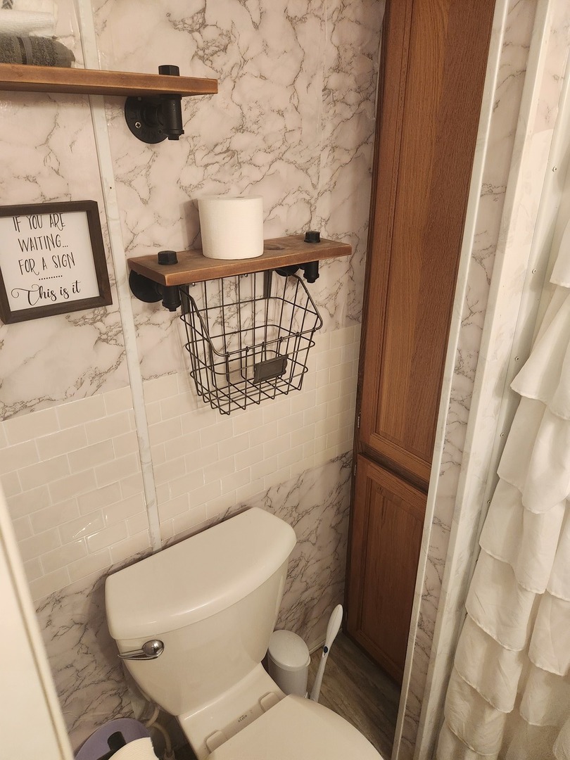 24-65 Woodhaven Lakes Sublette, IL 61367 - Photo 20 of 32 a bathroom with a toilet and a mirror
