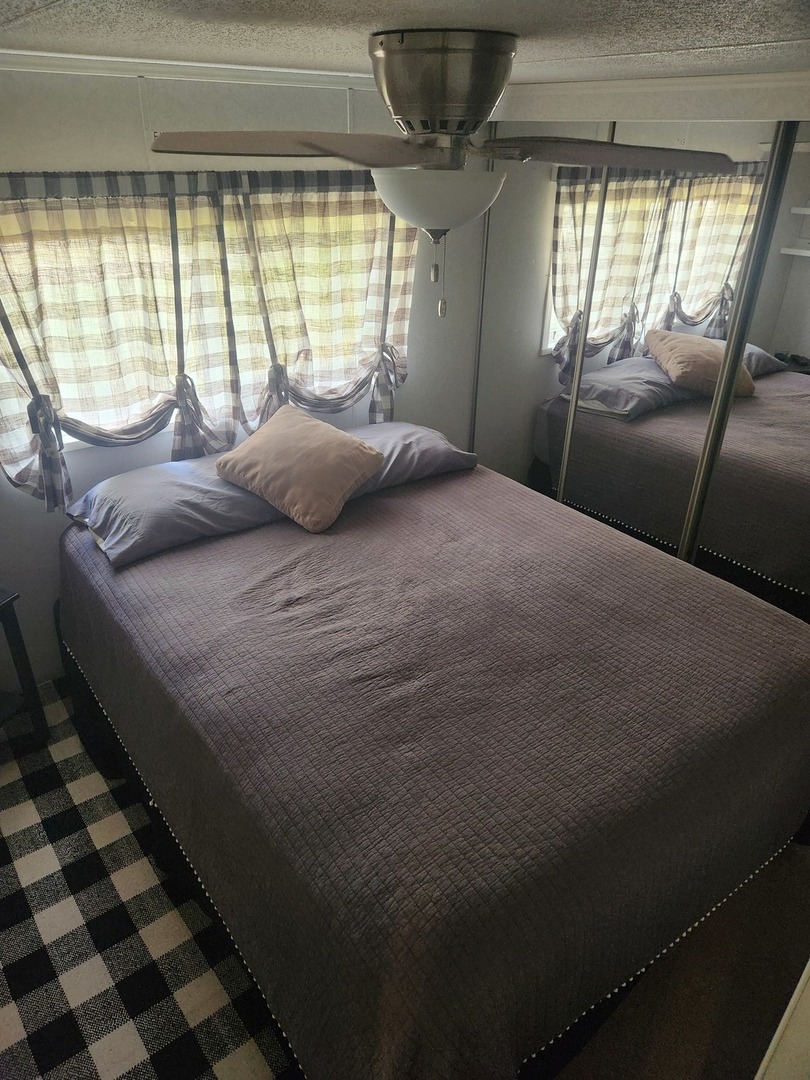 24-65 Woodhaven Lakes Sublette, IL 61367 - Photo 22 of 32 a bedroom with a bed and a window