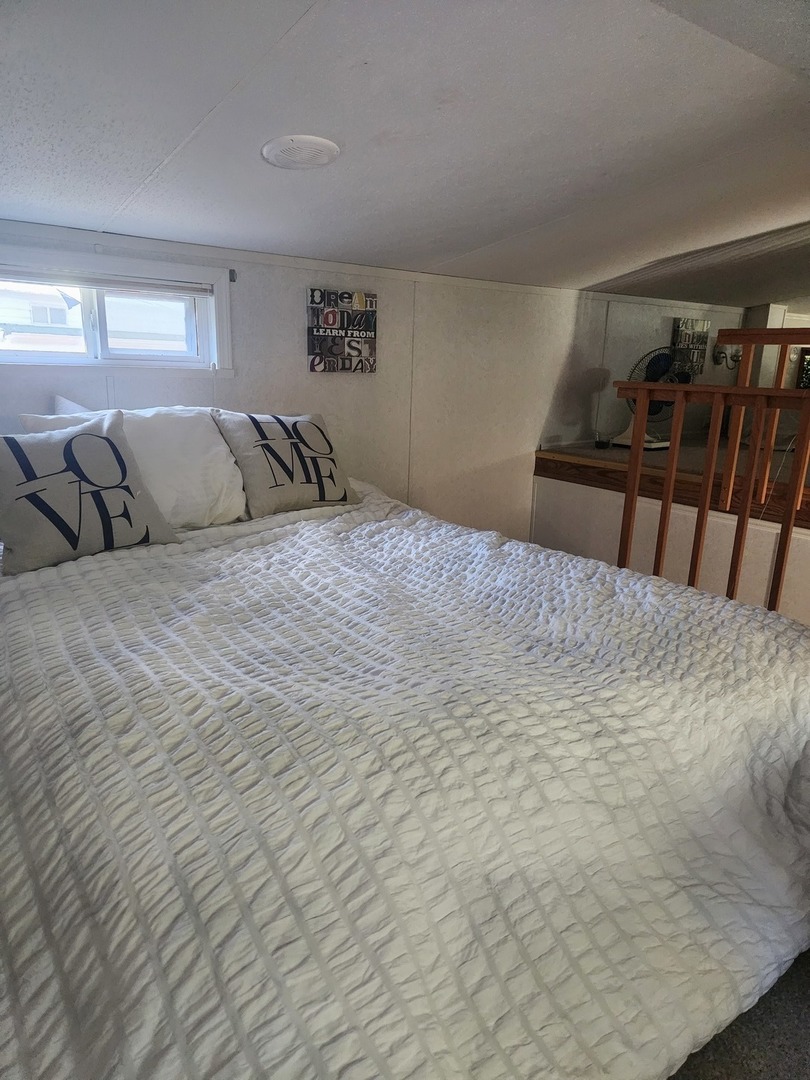 24-65 Woodhaven Lakes Sublette, IL 61367 - Photo 24 of 32 a large bed sitting in a bedroom and table