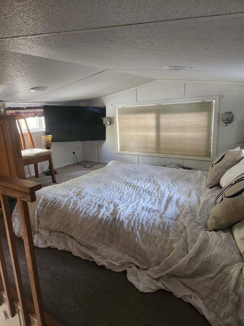 24-65 Woodhaven Lakes Sublette, IL 61367 - Photo 25 of 32 a bed sitting in a room next to a window