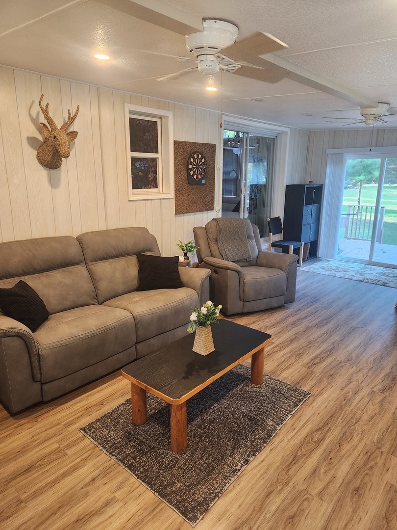 24-65 Woodhaven Lakes Sublette, IL 61367 - Photo 27 of 32 a living room with furniture and wooden floor