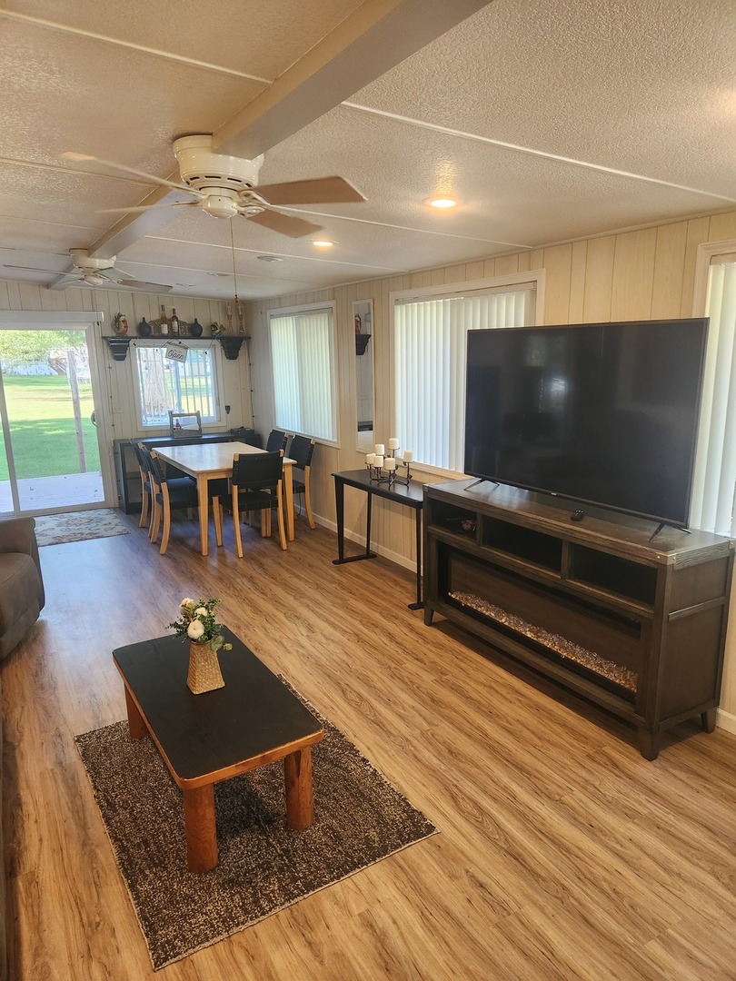 24-65 Woodhaven Lakes Sublette, IL 61367 - Photo 28 of 32 a living room with furniture and a flat screen tv