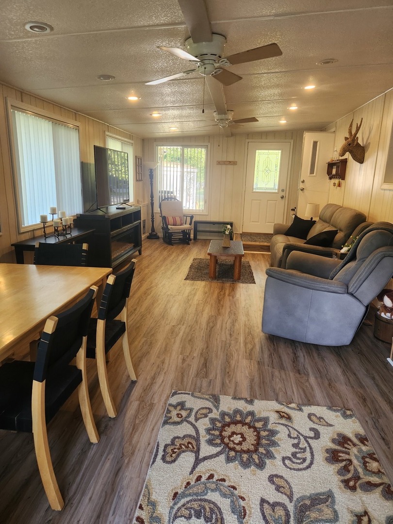 24-65 Woodhaven Lakes Sublette, IL 61367 - Photo 31 of 32 a living room with furniture and a wooden floor