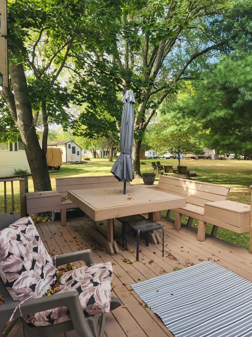 24-65 Woodhaven Lakes Sublette, IL 61367 - Photo 6 of 32 a view of a terrace with chairs and a table