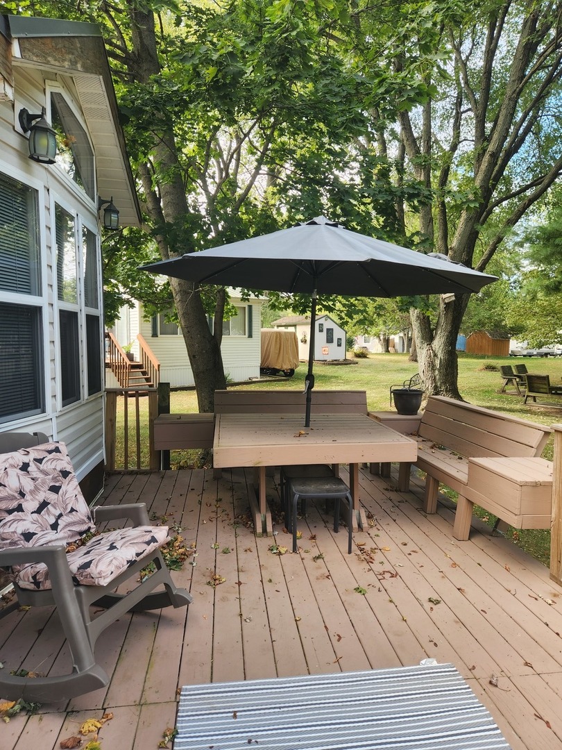 24-65 Woodhaven Lakes Sublette, IL 61367 - Photo 7 of 32 a view of backyard with outdoor seating