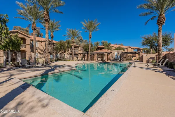 a view of a lake with a house in the background