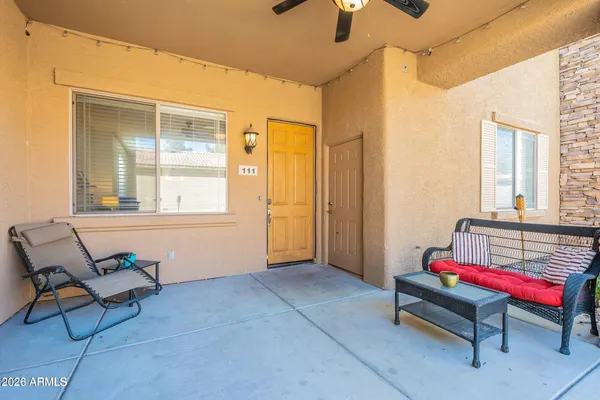 a living room with furniture and windows