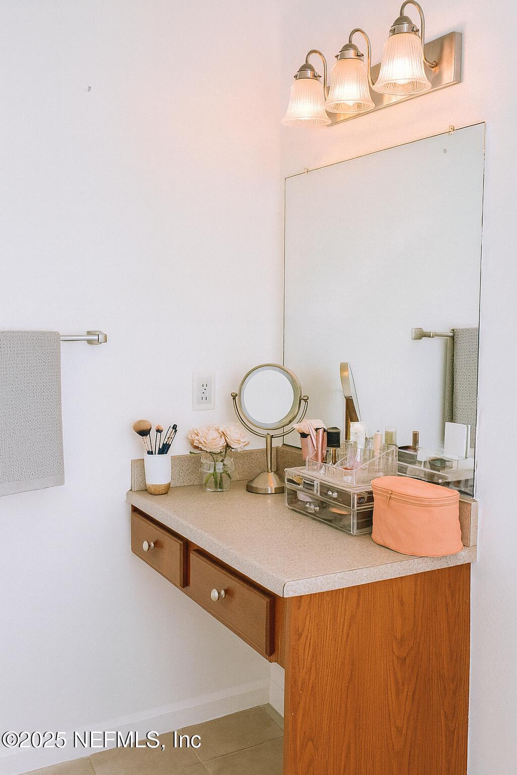 8550 Touchton Road, Unit 922 Jacksonville, FL 32216 - Photo 13 of 41 a bathroom with a sink double vanity and a mirror