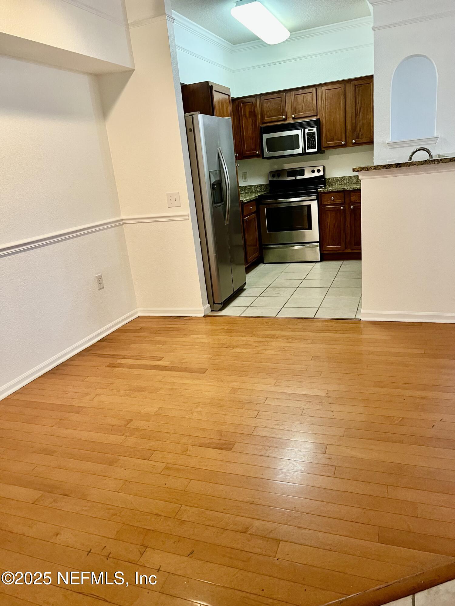 8550 Touchton Road, Unit 922 Jacksonville, FL 32216 - Photo 35 of 41 a view of kitchen with microwave and refrigerator