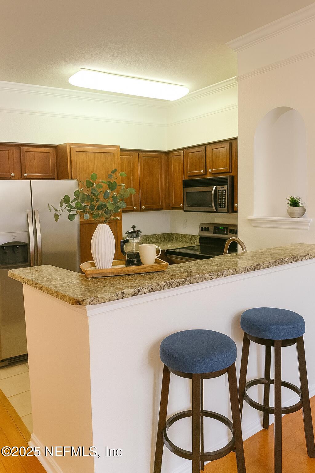 8550 Touchton Road, Unit 922 Jacksonville, FL 32216 - Photo 4 of 41 Bfast bar, virtual staged