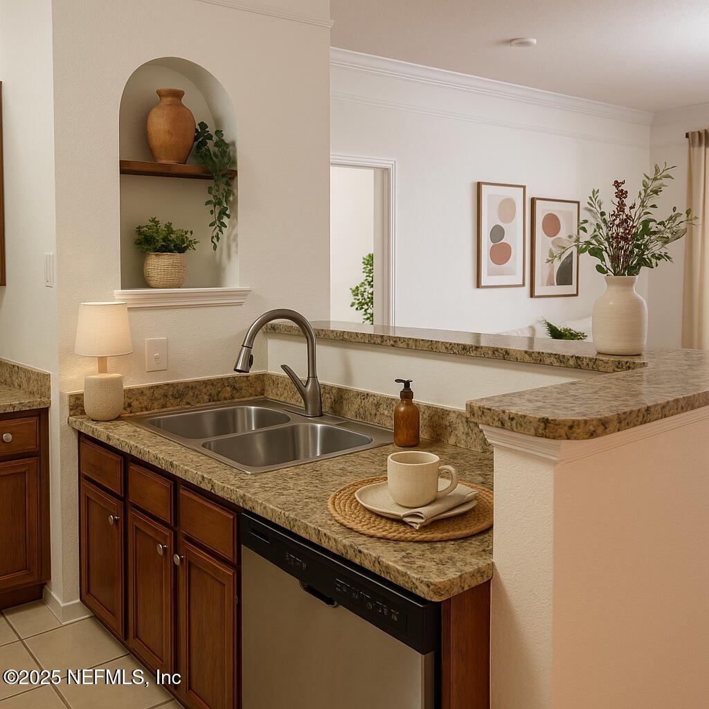 8550 Touchton Road, Unit 922 Jacksonville, FL 32216 - Photo 5 of 41 a bathroom with a granite countertop sink and a mirror