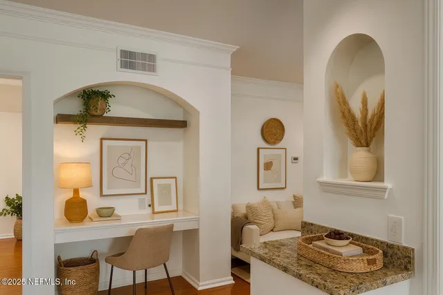 a view of kitchen with microwave and refrigerator