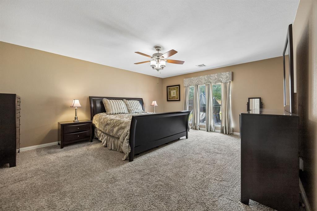 545 Rothschild Lane Murphy, TX 75094 - Photo 12 of 27 Spacious primary bedroom as a private retreat.