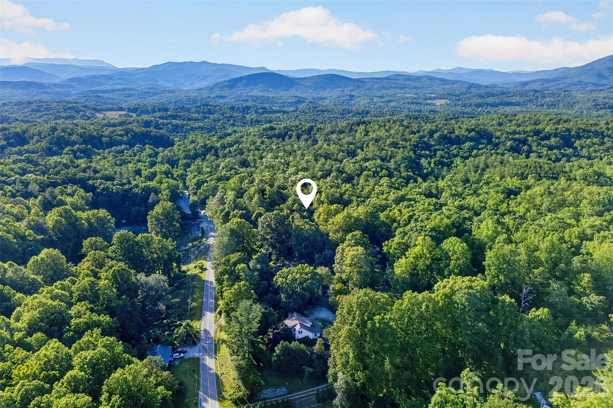 0 Yancey Road Marion, NC 28752 - Photo 5 of 32 a view of a lush green field with lots of bushes