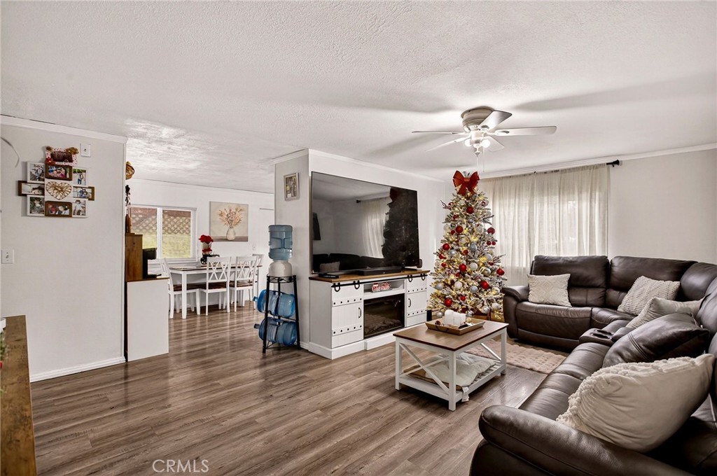 3156 Esplanade, Unit 292 Chico, CA 95973 - Photo 11 of 44 a living room with furniture flat screen tv and wooden floor