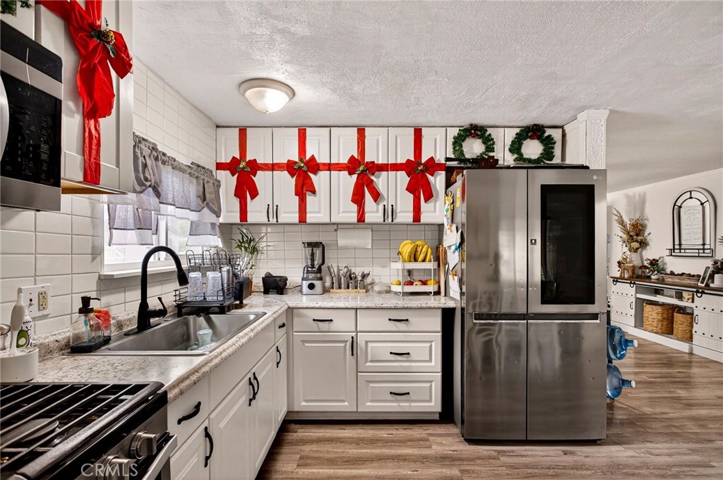 3156 Esplanade, Unit 292 Chico, CA 95973 - Photo 14 of 44 a kitchen with stainless steel appliances granite countertop a refrigerator and a sink