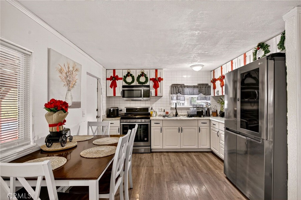 3156 Esplanade, Unit 292 Chico, CA 95973 - Photo 16 of 44 a kitchen with granite countertop stainless steel appliances a sink and a refrigerator