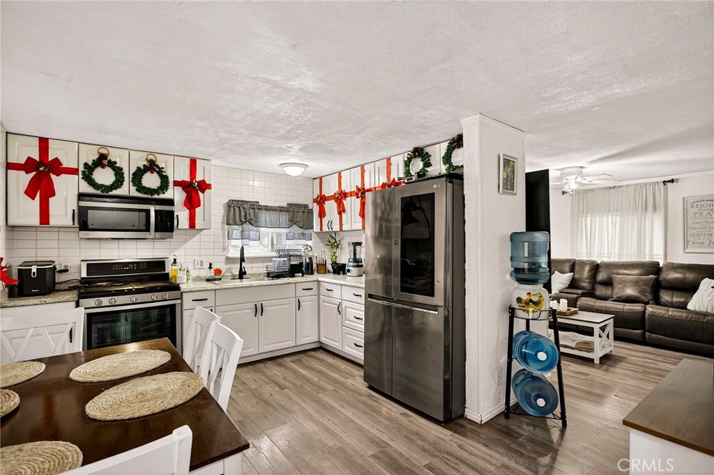 3156 Esplanade, Unit 292 Chico, CA 95973 - Photo 17 of 44 a kitchen with stainless steel appliances granite countertop a refrigerator stove top oven and sink