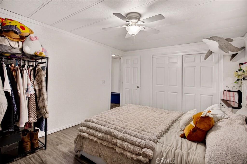 3156 Esplanade, Unit 292 Chico, CA 95973 - Photo 19 of 44 a bedroom with a bed and a chandelier