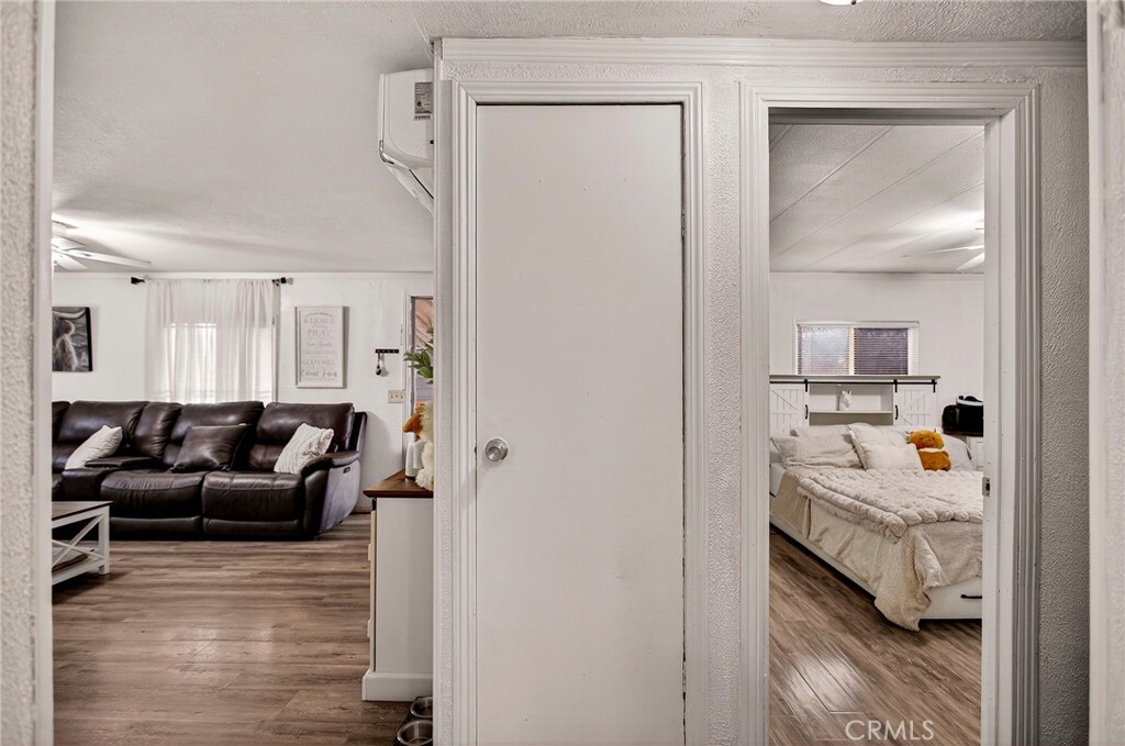 3156 Esplanade, Unit 292 Chico, CA 95973 - Photo 21 of 44 a bedroom with furniture and a wooden floor