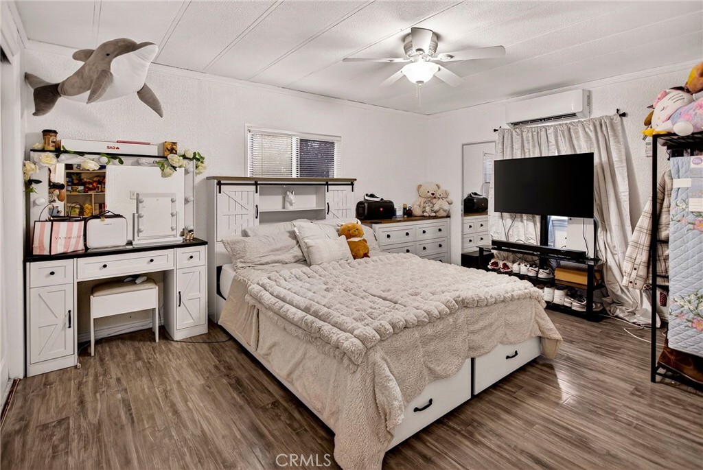 3156 Esplanade, Unit 292 Chico, CA 95973 - Photo 30 of 44 a bedroom with bed tv and view of the bathroom