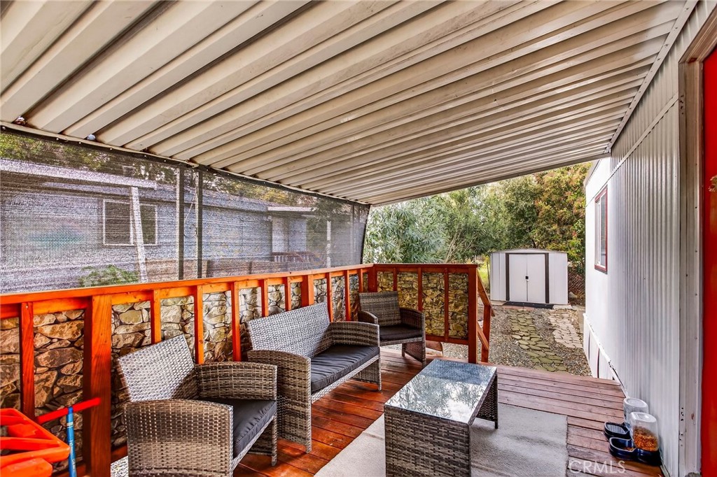 3156 Esplanade, Unit 292 Chico, CA 95973 - Photo 31 of 44 a balcony with wooden floor and furniture