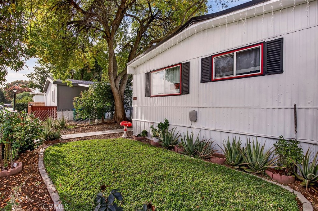 3156 Esplanade, Unit 292 Chico, CA 95973 - Photo 34 of 44 a front view of a house with a yard