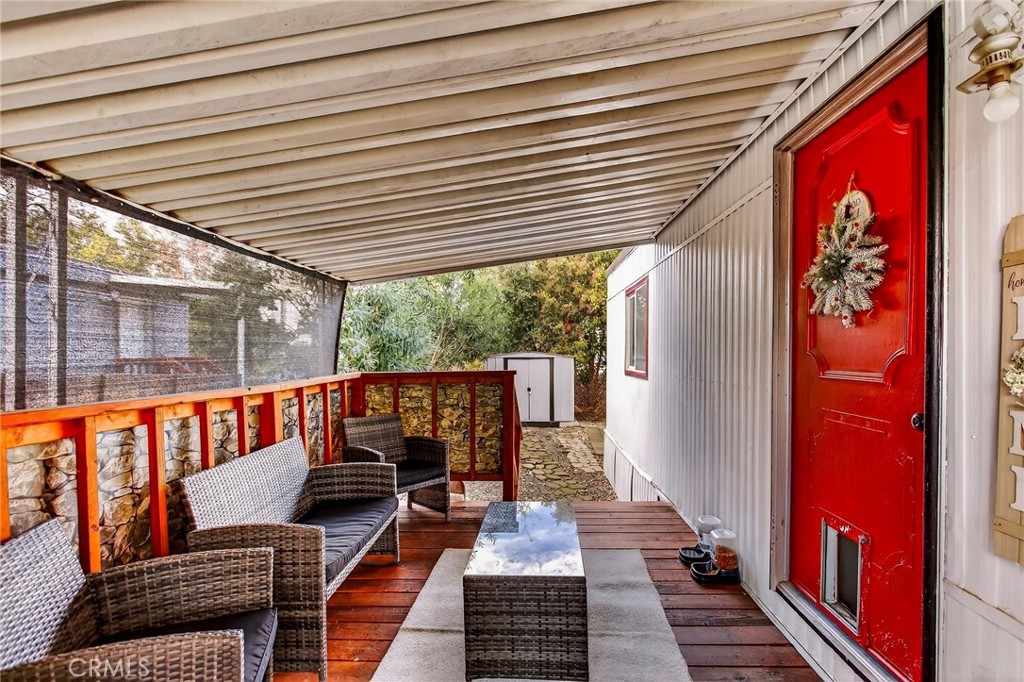 3156 Esplanade, Unit 292 Chico, CA 95973 - Photo 8 of 44 a balcony with furniture and wooden floor