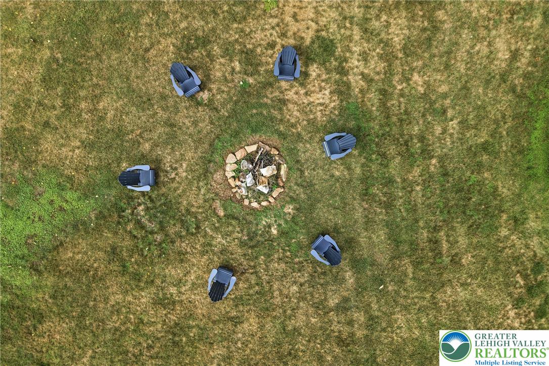 1553 Surrey Road Bethlehem, PA 18015 - Photo 89 of 92 Gather around the fire pit for evenings of outdoor enjoyment in this verdant yard.