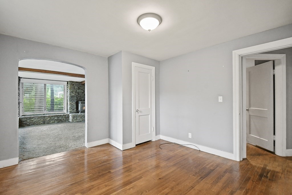 40 New Boston Road Sturbridge, MA 01566 - Photo 11 of 36 an empty room with wooden floor and windows