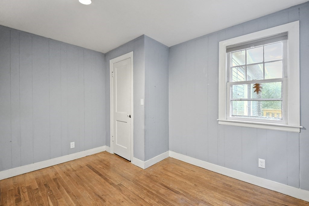 40 New Boston Road Sturbridge, MA 01566 - Photo 15 of 36 a view of an empty room with wooden floor and a window