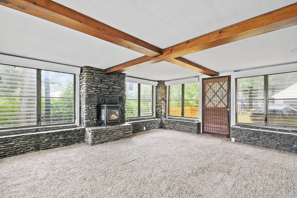 40 New Boston Road Sturbridge, MA 01566 - Photo 16 of 36 a view of an empty room with wooden floor and a window