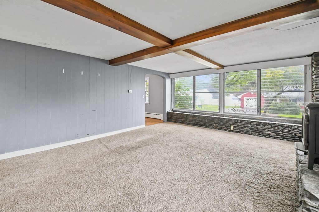 40 New Boston Road Sturbridge, MA 01566 - Photo 18 of 36 an empty room with wooden floor and windows