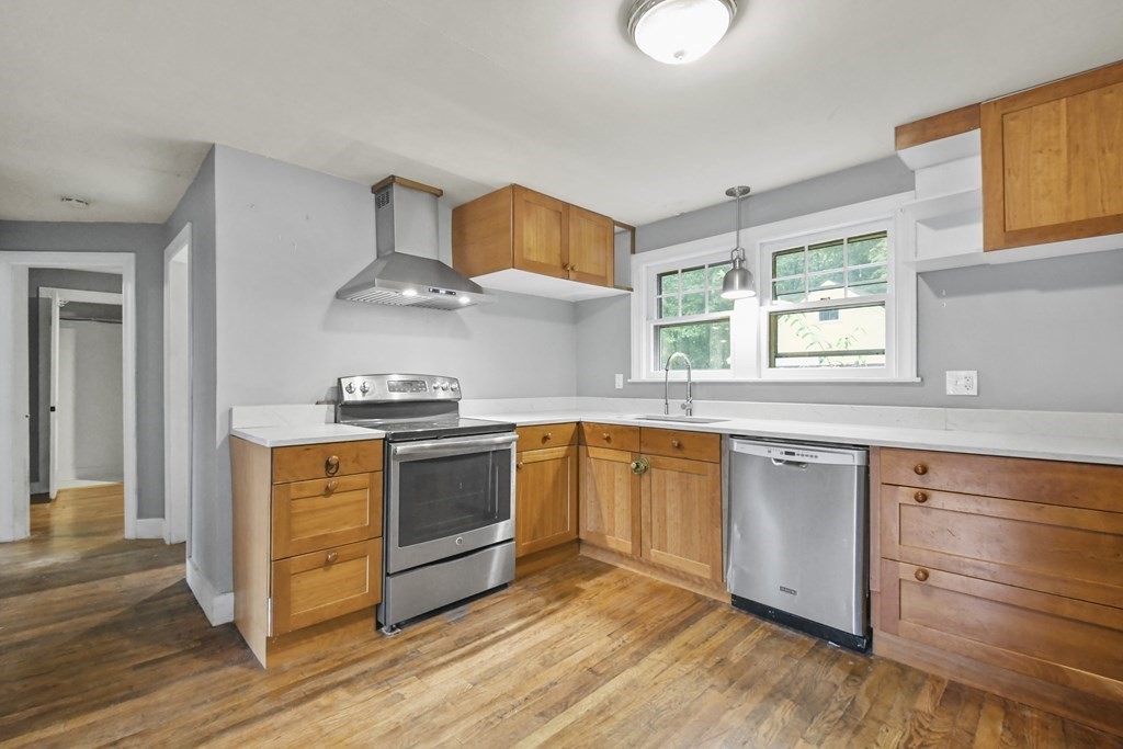 40 New Boston Road Sturbridge, MA 01566 - Photo 2 of 36 a kitchen with stainless steel appliances granite countertop a sink a stove and wooden floors