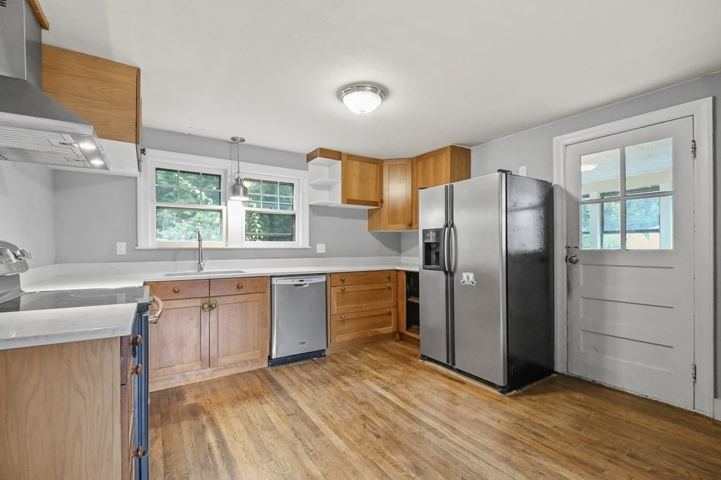 40 New Boston Road Sturbridge, MA 01566 - Photo 3 of 36 a kitchen with stainless steel appliances granite countertop a refrigerator and a sink