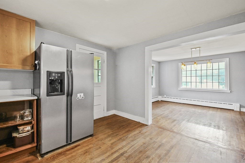 40 New Boston Road Sturbridge, MA 01566 - Photo 4 of 36 a view of an empty room with window and refrigerator