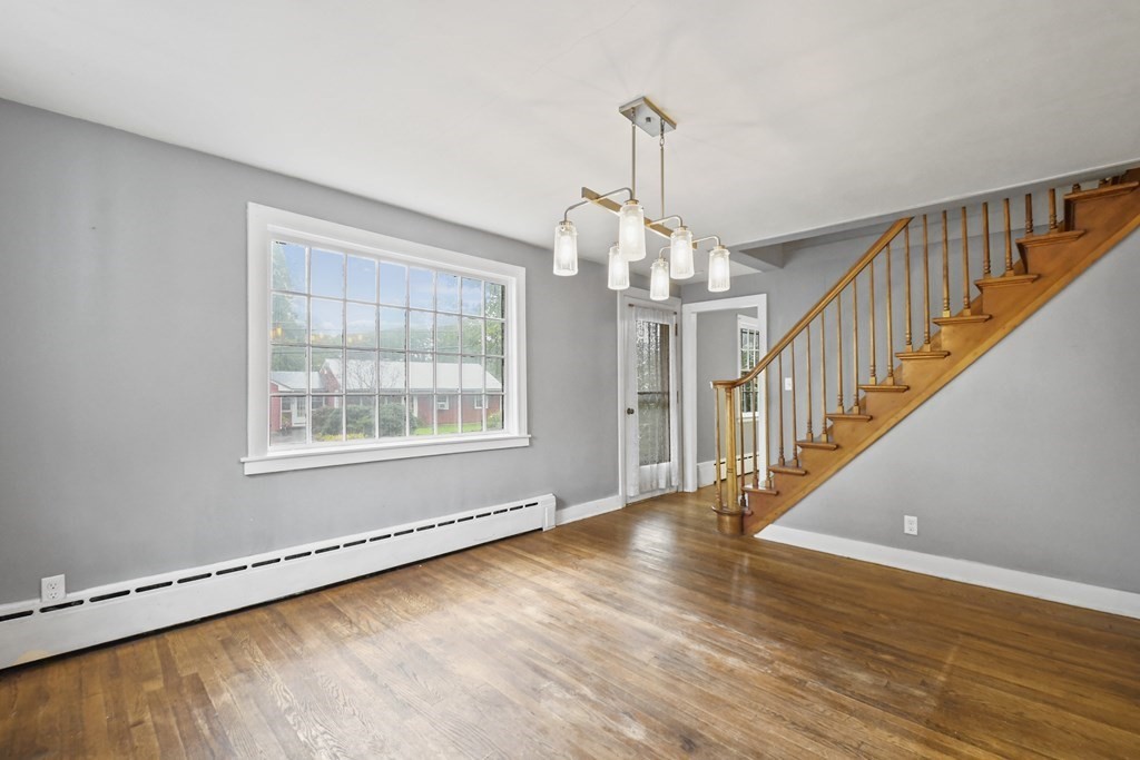 40 New Boston Road Sturbridge, MA 01566 - Photo 6 of 36 a view of an empty room with wooden floor and a window