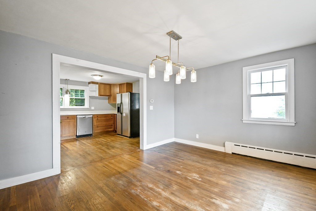 40 New Boston Road Sturbridge, MA 01566 - Photo 8 of 36 a view of a kitchen with a dishwasher cabinets and a wooden floor
