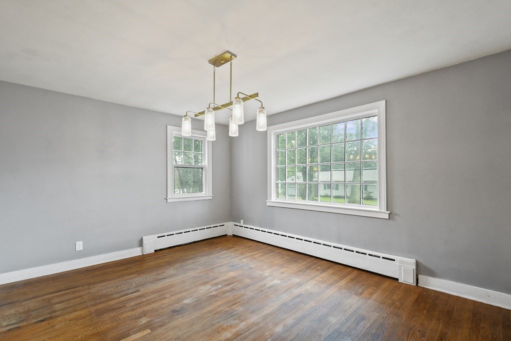 40 New Boston Road Sturbridge, MA 01566 - Photo 9 of 36 an empty room with wooden floor and windows