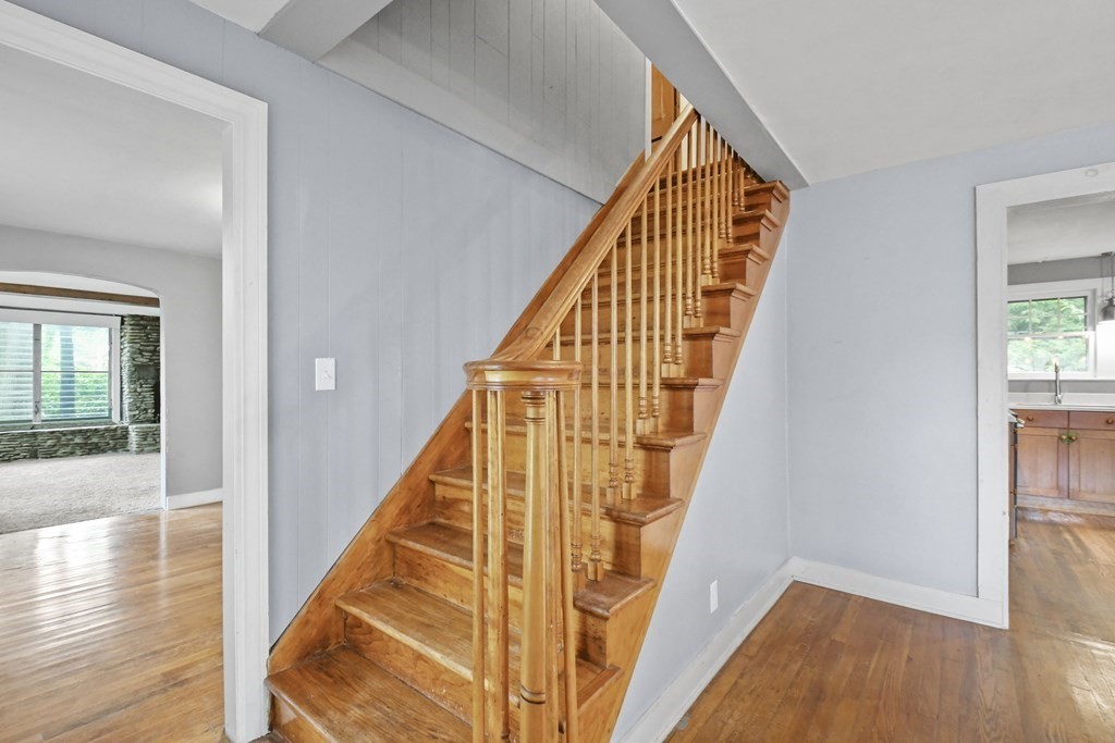 40 New Boston Road Sturbridge, MA 01566 - Photo 10 of 36 a view of staircase with railing and wooden floor