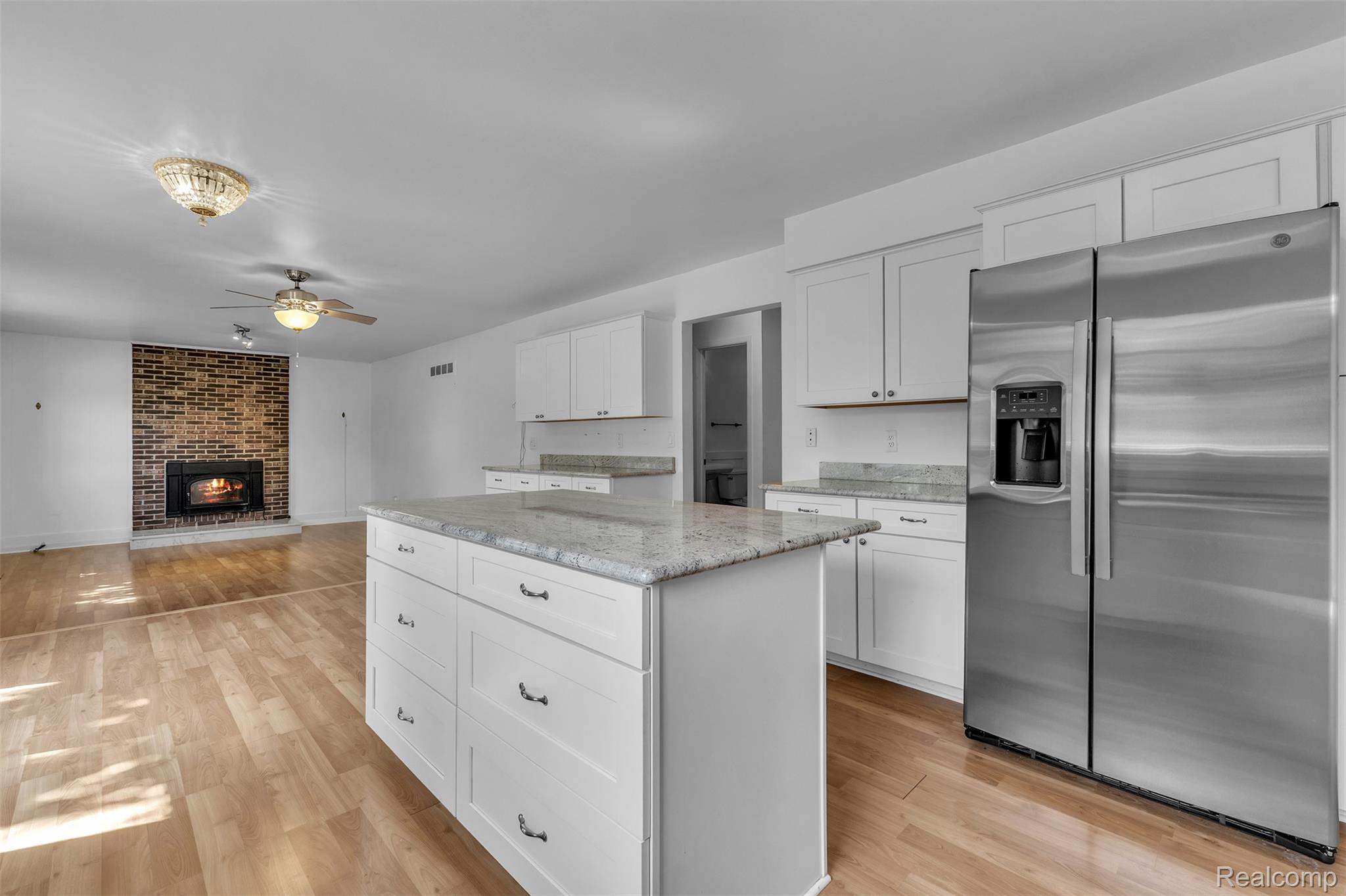 7000 Woonsocket Street Canton, MI 48187 - Photo 17 of 65 Kitchen featuring an island with stone countertop and white cabinetry