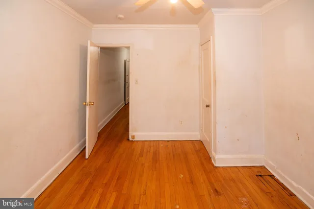 a view of a room with wooden floor