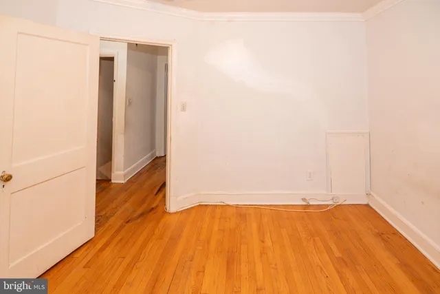 a white toilet sitting next to a bath tub