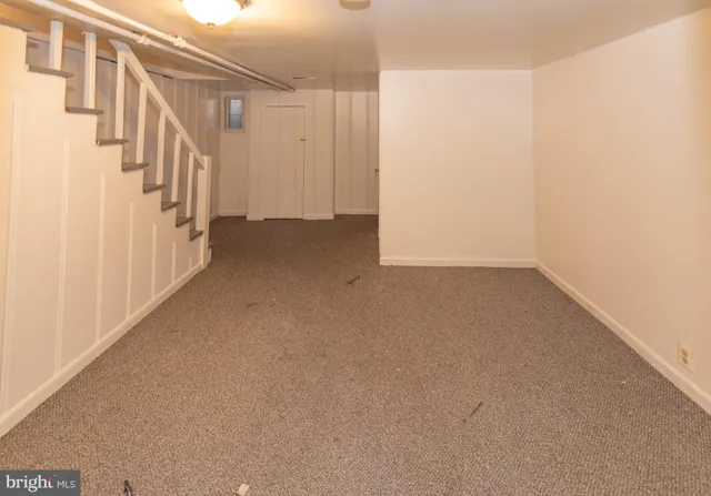 a view of a hallway with staircase